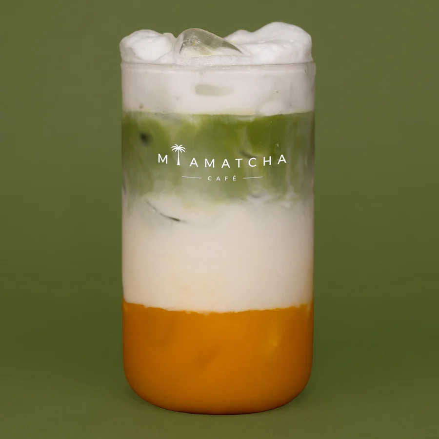 Iced mango matcha latte: mango base, matcha, then milk foam